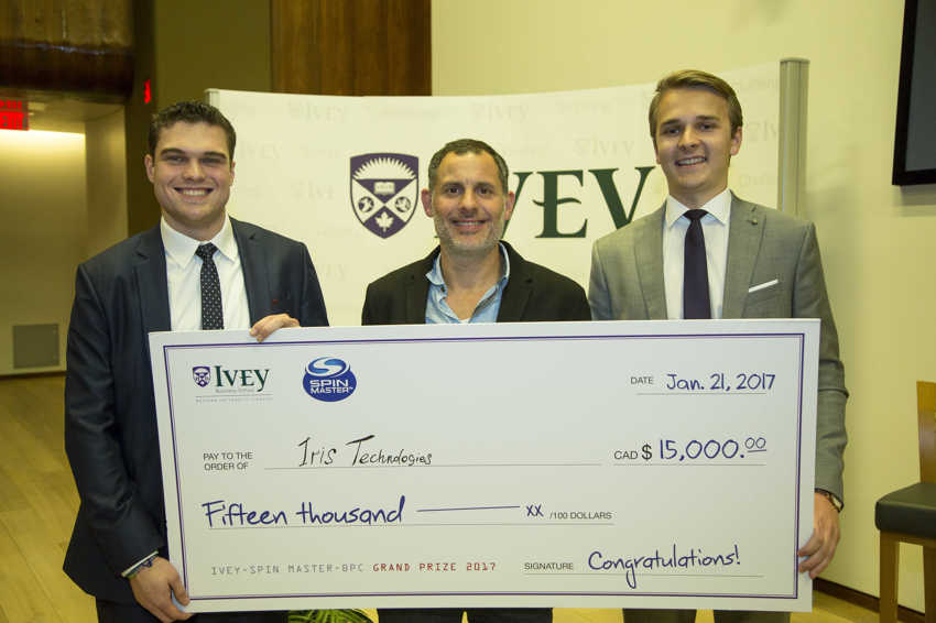 Team Iris Technologies is presented the winning cheque by Darren Rabie, HBA '96, brother of Anton Rabie, HBA '95 of Spin Master Ltd.