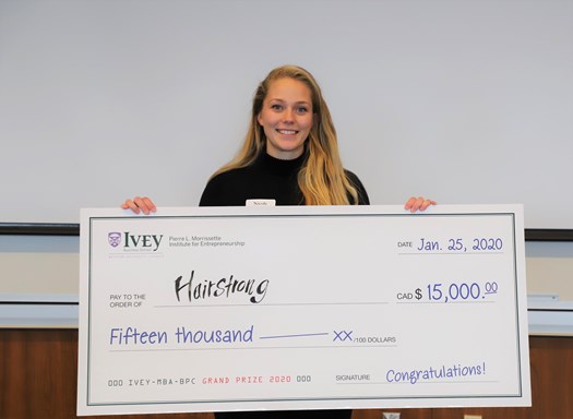 Team Hairstrong holding winning cheque of MBA Ivey Business Plan Competition 2020