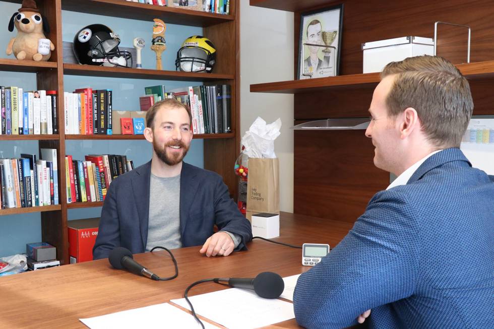 Michael Katchen recording a podcast with a faculty member Eric Janssen