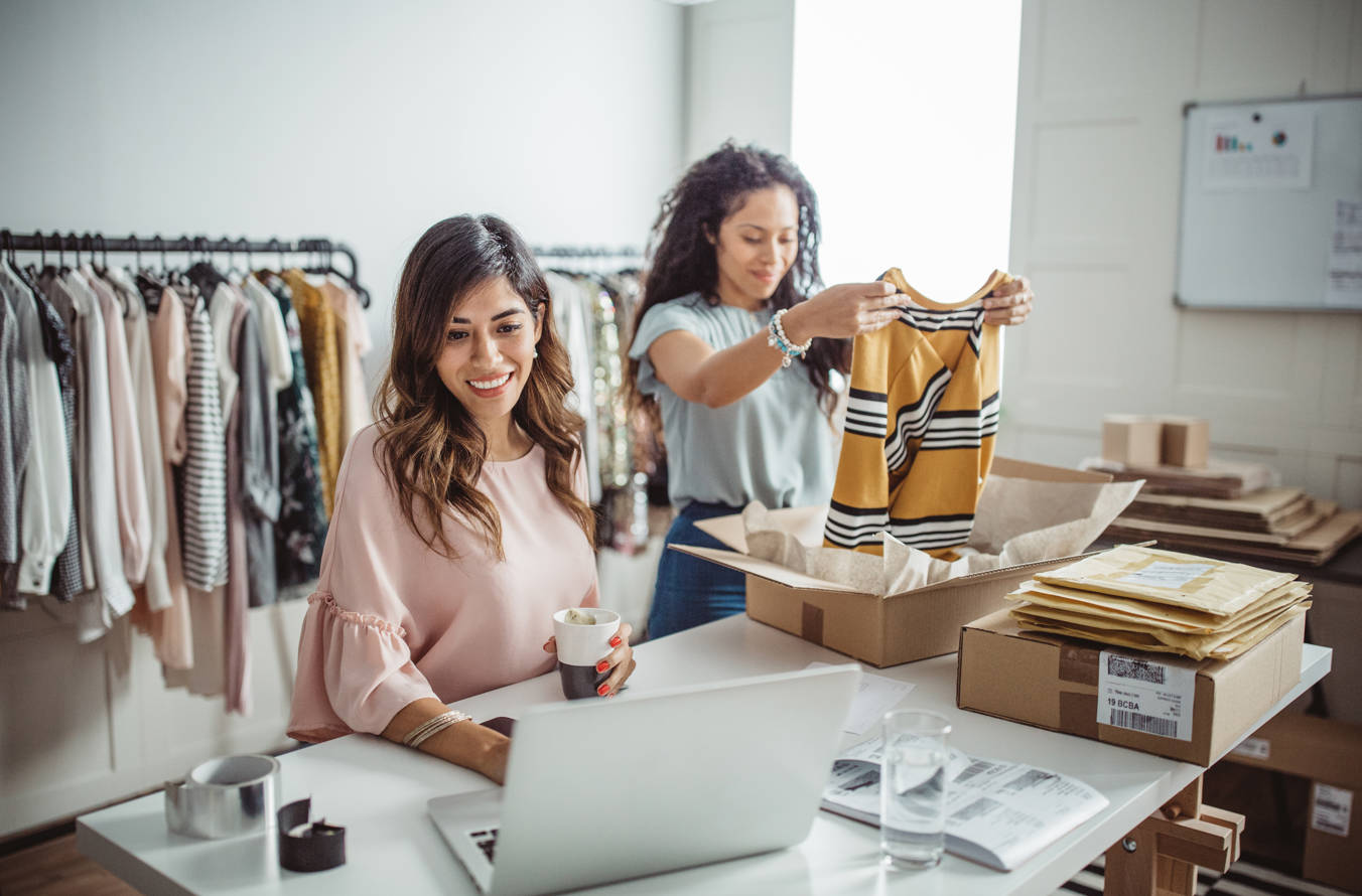 Two women working on their clothing startup