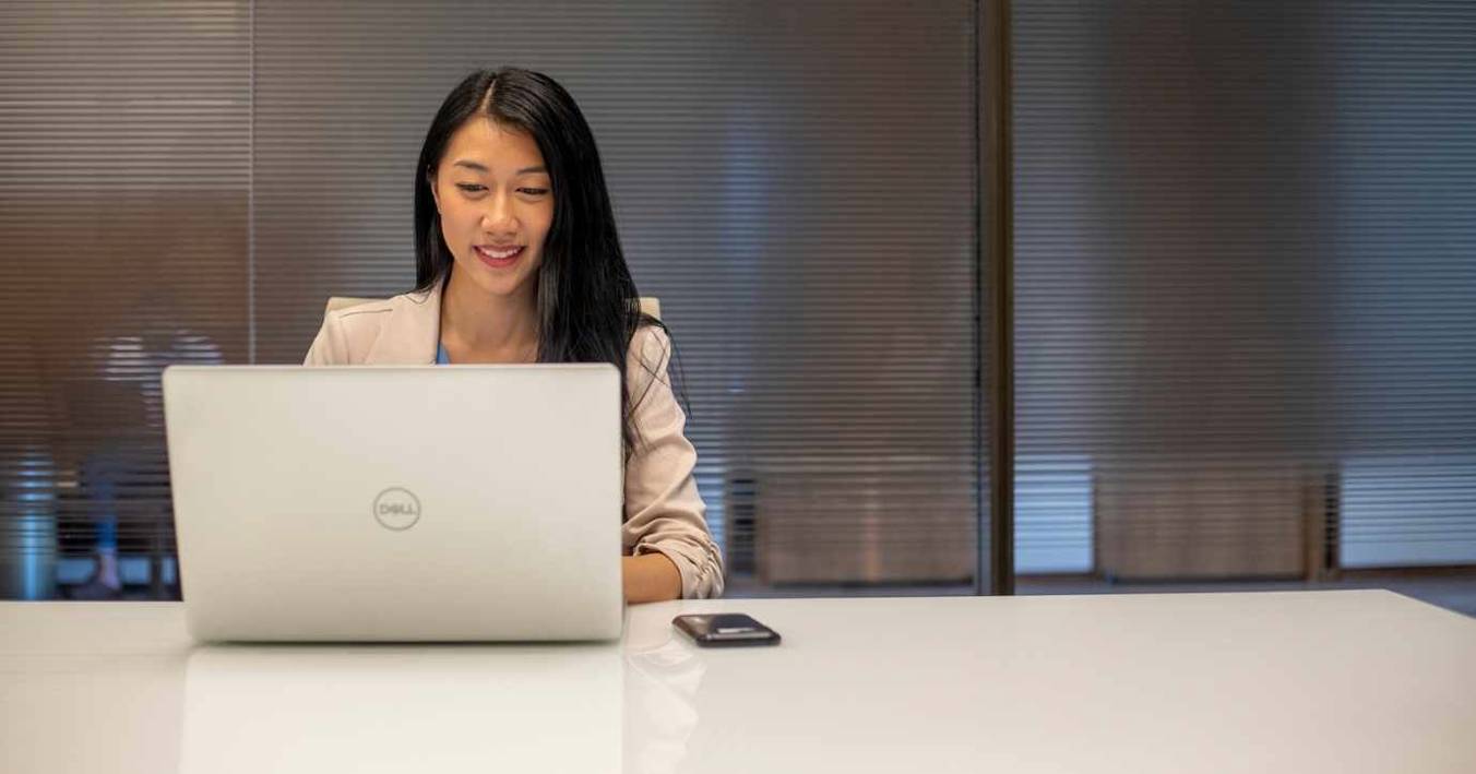 Student Working On Laptop In Study Room