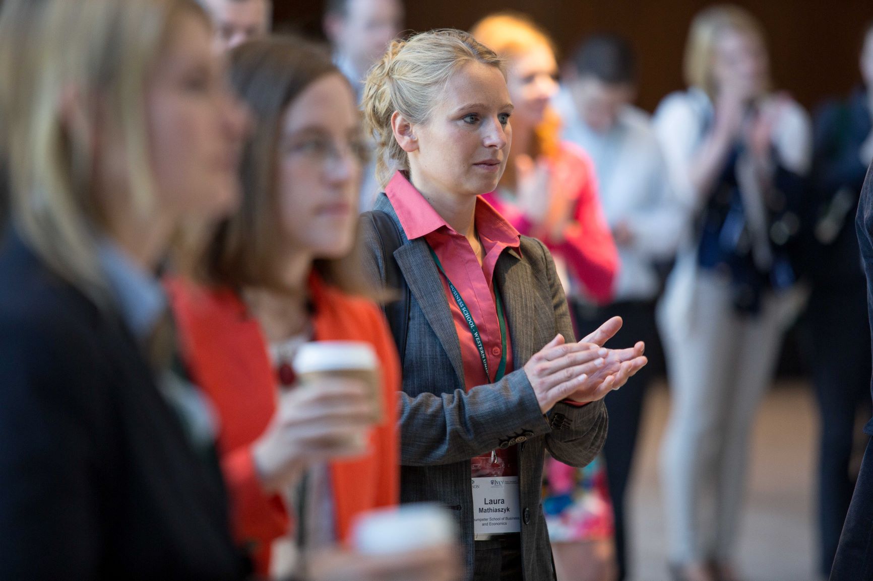 Academics listening to opening remarks at a conference