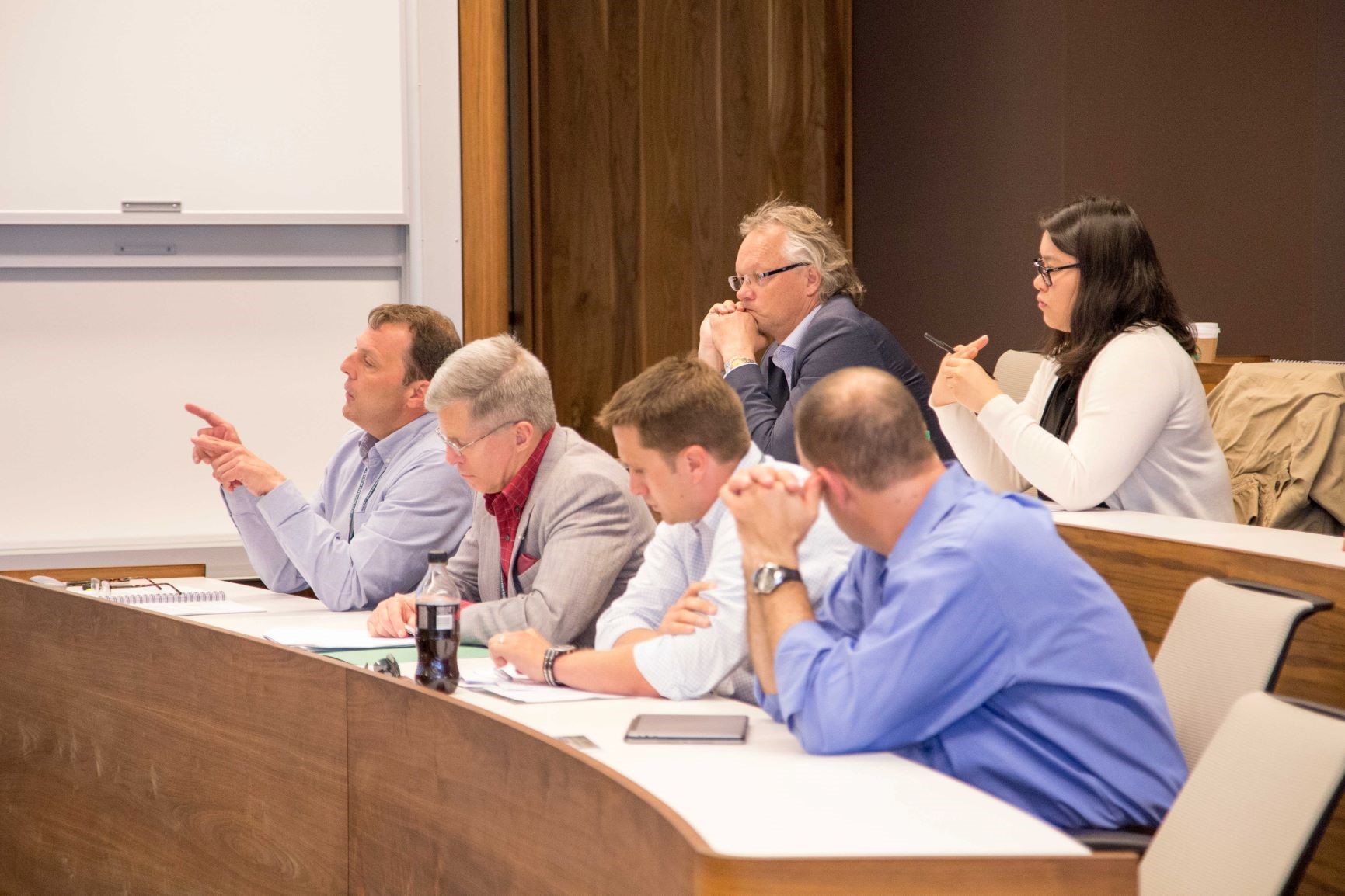 Faculty discussing a research presentation