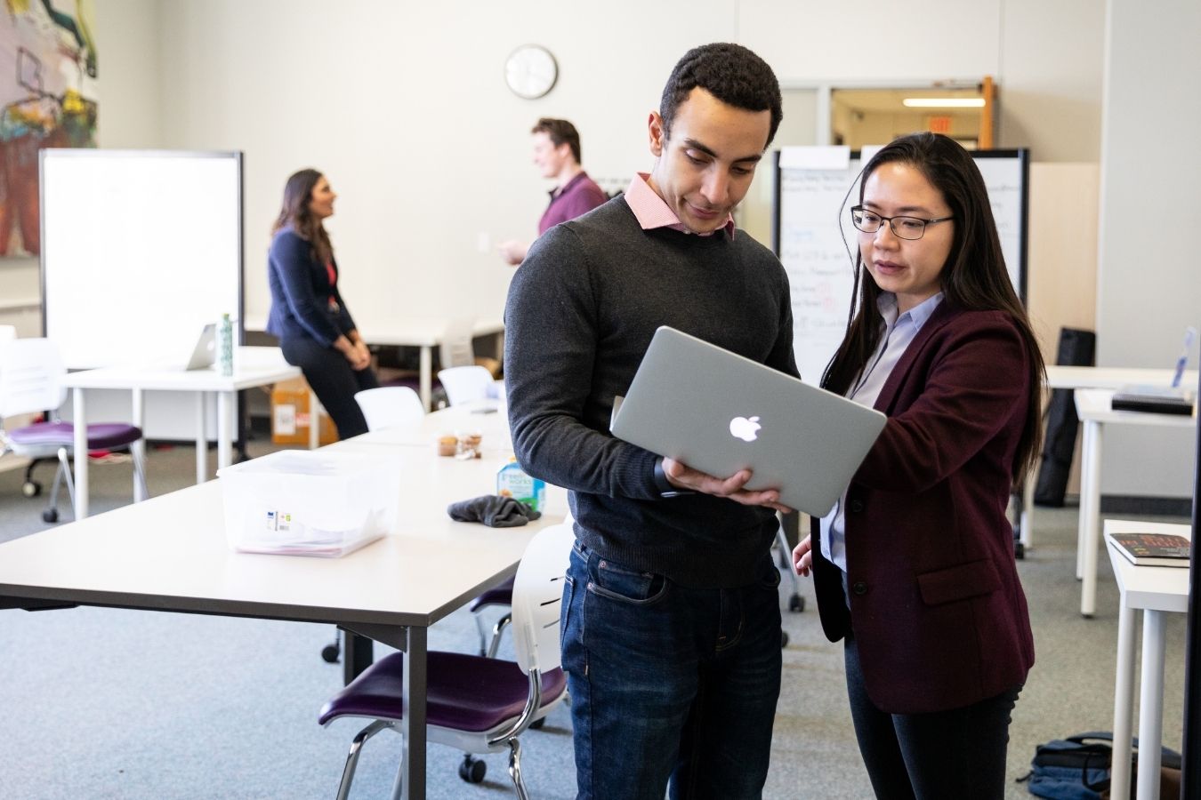 Western Accelerator Particpants Work Together Over A Laptop