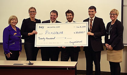Team Picasolar holding winning cheque from MBA Ivey Business Plan Competition 2013
