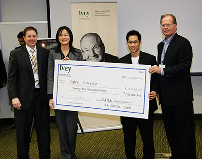 Team Shape Collage holding winning cheque from MBA Ivey Business Plan Competition 2010