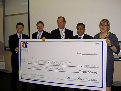 Team Epitherapeutics holding winning cheque from MBA Ivey Business Plan Competition 2009